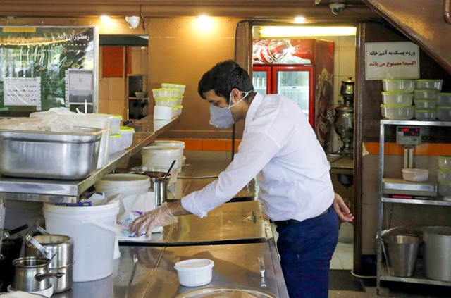 Iran eases restaurant curbs as virus claims 57 more lives