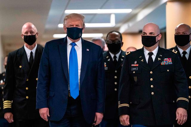Trump finally dons mask as US sets new virus case record
