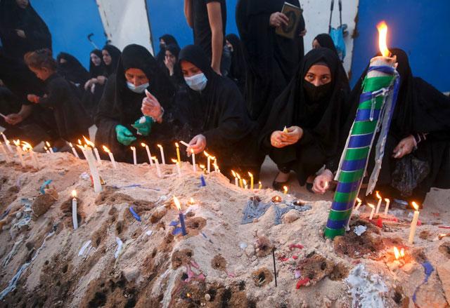 Masks and tears: Shiites mark Ashura at Iraq shrines despite virus