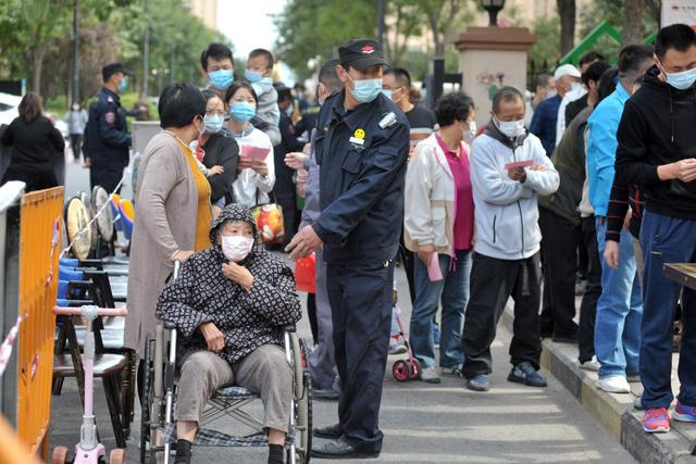 China tests entire city for virus as Europe tightens controls