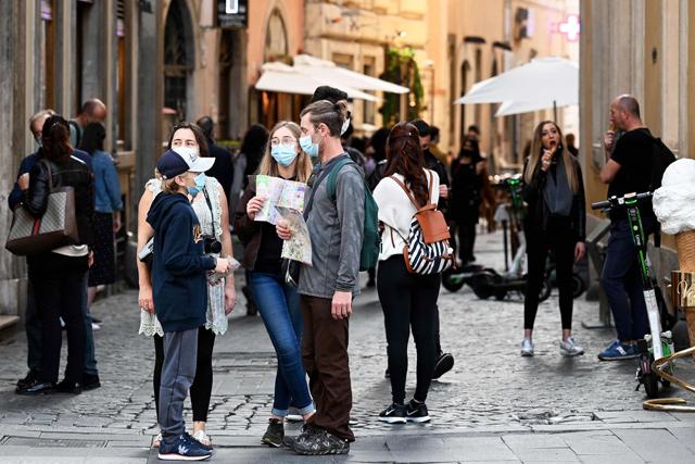 Italy imposes tough virus curbs as US cases hit record highs