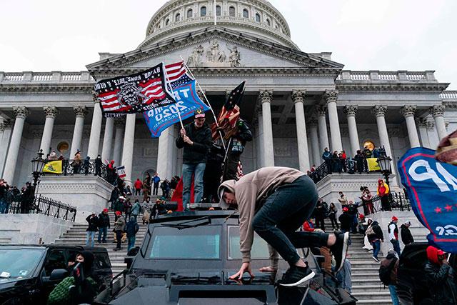 Russia sees US democracy limping after Capitol stormed