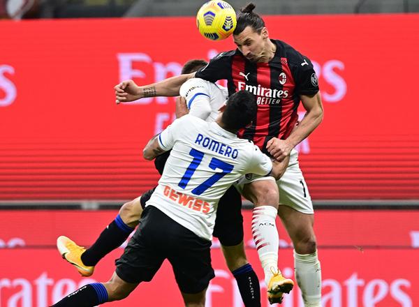 AC Milan stay top despite defeat as rivals Inter held