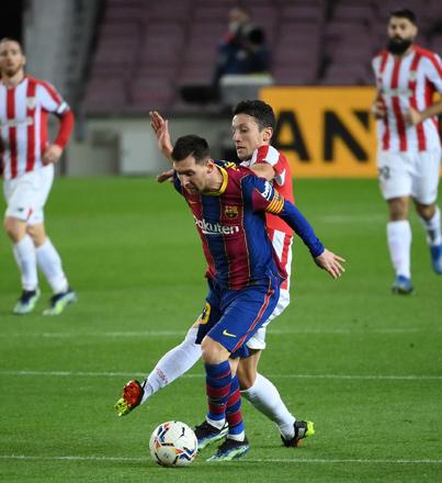 Messi shows his worth but Atletico stretch lead