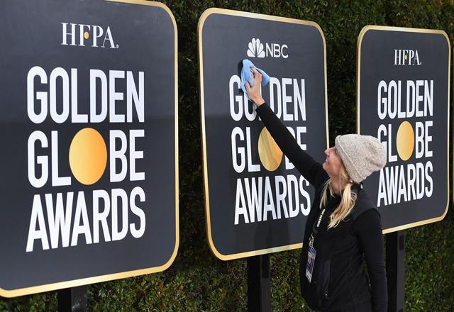 Golden Globes eye history as show goes on without stars