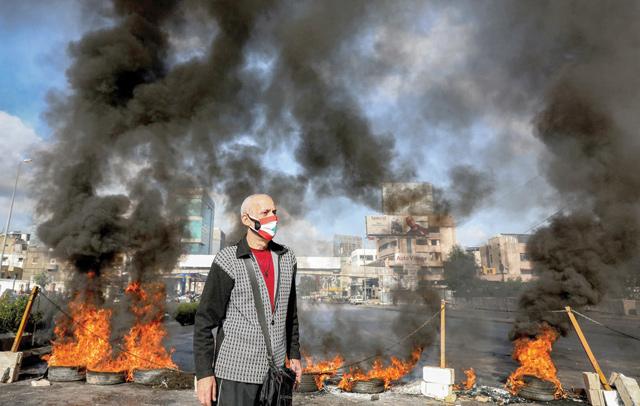 Lebanese block roads in protest at poverty, political inaction