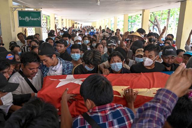 Protester shot dead in central Myanmar and two Australians in custody