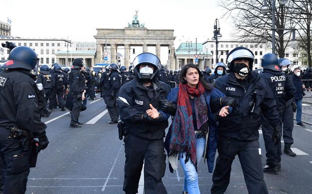 Police clash with protesters as Germany passes virus law