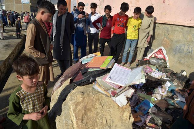 Afghans bury dead from bloody school blasts