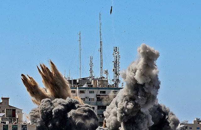 Israel flattens Gaza building hosting AP, Jazeera in air strike