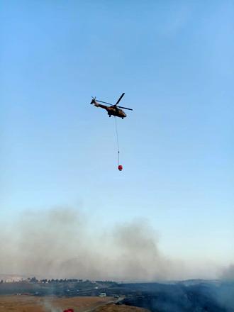 Joint operation extinguishes fire originating from west of Jordan River