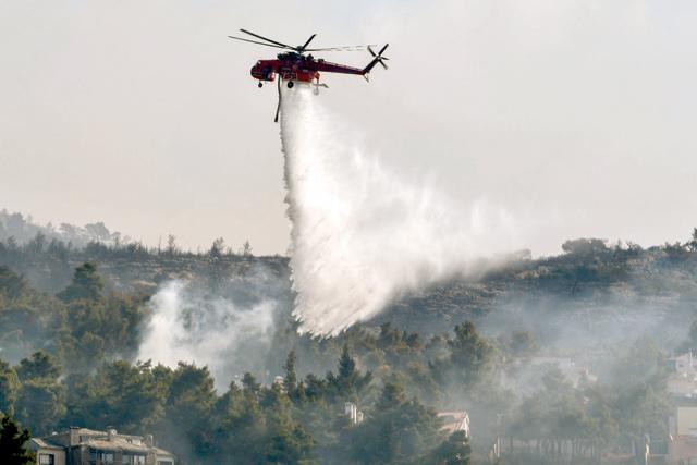 Hundreds of families homeless as Greek fires rage, Turkey saved by the rain