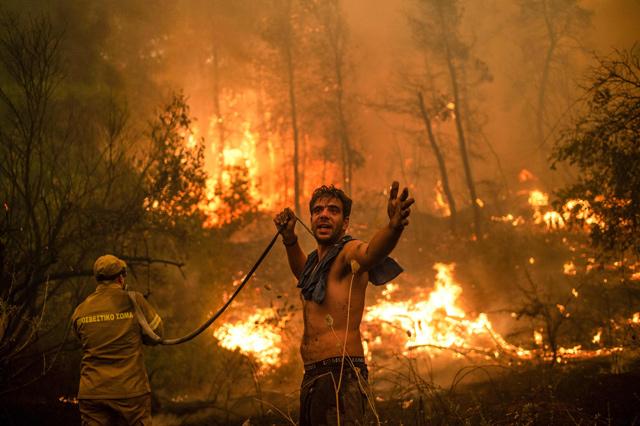 Hundreds flee, homes destroyed, as fires ravage Greek island