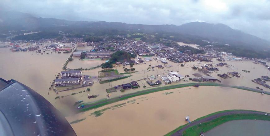 Japan urges evacuations as rain sparks floods, landslides