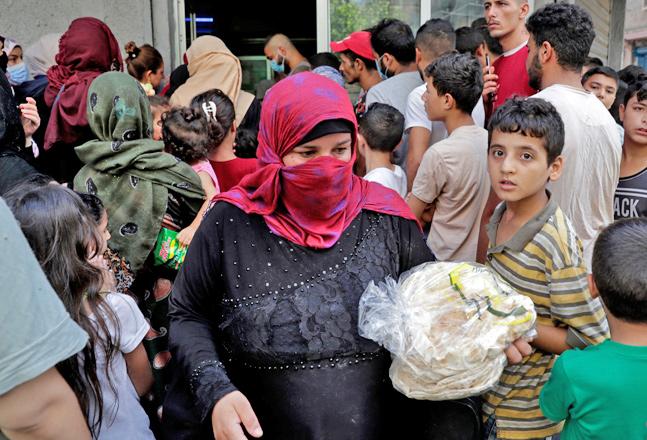 Consumers queue for bread in Lebanon