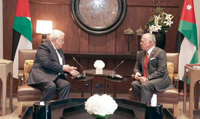 King, Palestinian president discuss efforts to advance peace process