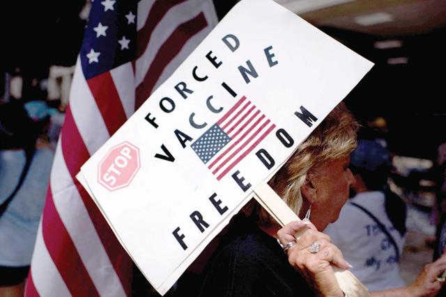 More US firms require vaccine