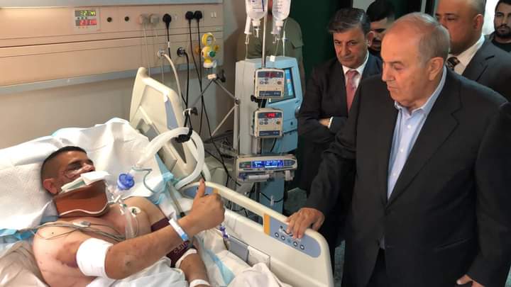 اياد علاوي يزور العقيد حسين فهمي في مدينة الحسين الطبية