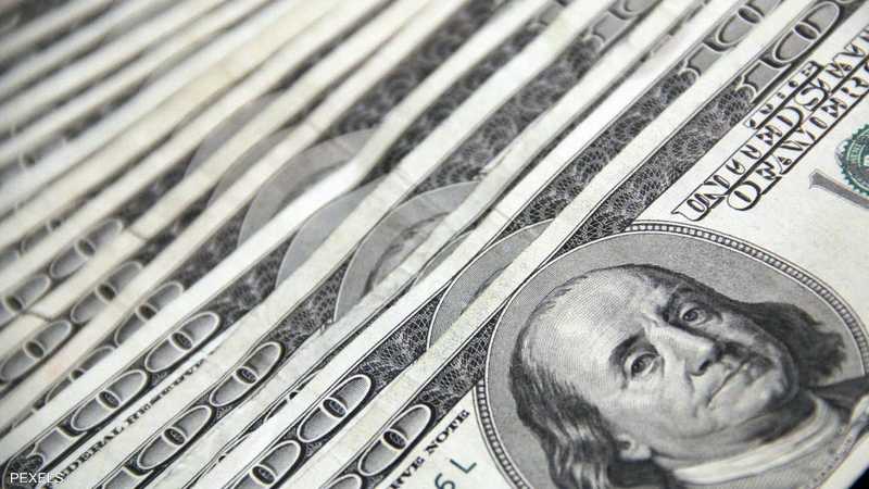 تراجع طفيف للدولار مع هدوء توقعات المستثمرين بشأن الفائدة