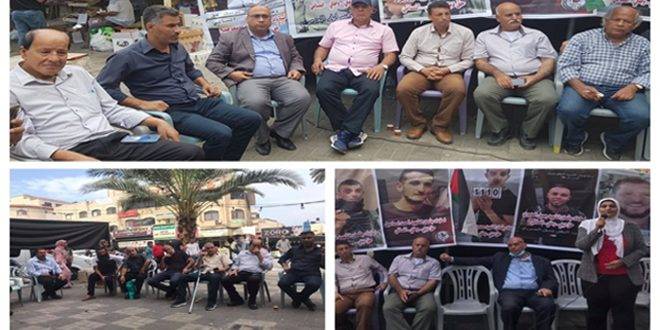 وقفة في الخليل للمطالبة باسترداد جثامين الشهداء بمعتقلات الاحتلال