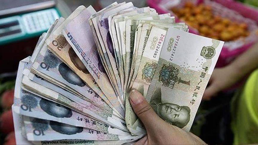 الصين تحدد سعر الدولار مقابل اليوان عند 6.9468