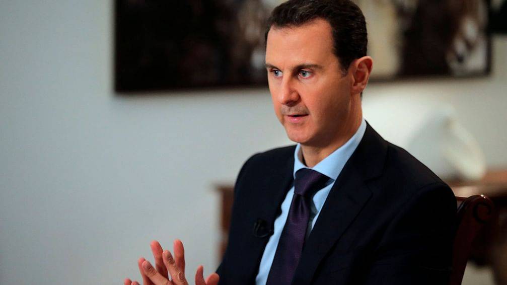 وكالة سانا: مصافحة بين الأسد وأمير قطر قبل القمة العربية