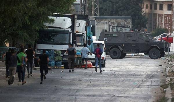 مواجهات واعتقالات بالضفة واشتباكات قرب جنين