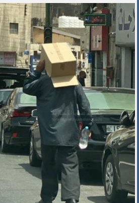 شاهد  رجل يرتدي كرتونة برأسه نتيجة الحر الشديد في عمان