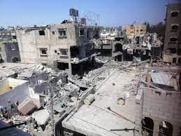 14 شهيدا واصابات بقصف منزل في دير البلح